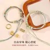 Pulsera de hebilla de paz cuerda trenzada producto semiacabado hecho a mano se puede usar como flor de solapa cuentas de transferencia doradas año zodiacal pulsera de cuerda roja para mujer