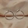 Pendientes de aro lisos exagerados estilo millennial, pendientes grandes elegantes y de alta gama para mujer, diseño de lujo ligero, pendientes de botón y accesorios de moda