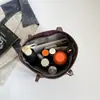 Bolso de Mano con Textura para el Trabajo y el Viaje Nuevo Primavera 2026 Estilo Coreano Bolso de Hombro Único para Mujer Bolso Tote Versátil de Moda