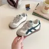 Zapatos de lona estilo coreano para niños, entrenamiento alemán 2025, nuevos para niños y niñas, primavera y otoño, casual, suela suave, superficie de cuero, zapatillas deportivas para bebé