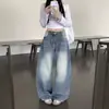 Jeans retro americanos de mezclilla lavada azul con dobladillo curvo desgastado para mujeres petite, corte holgado, adelgazantes, pantalones rectos de pierna ancha hasta el suelo
