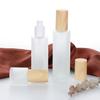 Botella de loción con cubierta de veta de madera, botella portátil de vidrio esmerilado para el cuidado de la piel, botella de cosméticos, muestra de vidrio de base líquida, botella vacía