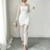 Vestido de mujer de Amazon transfronterizo elegante con retazos de encaje negro, cuello alto, manga larga, transparente, ajustado, bodycon
