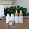 Botella de porcelana blanca para aceite esencial serie de botellas de jade blanco moteado botella para cuidado de la piel vidrio lechoso porcelana blanca crema crema botella de set cosmético
