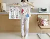 Pijama transfronteiriço de verão feminino conjunto de três peças de seda de leite desenho animado comércio exterior roupa de casa manga curta calça comprida estilo fofo