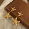 Novos brincos de design de nicho para mulheres, de alta qualidade, moda, personalidade, costura de estrela-do-mar, aço titânio banhado a ouro 18K, transfronteiriços