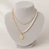 Collar con colgante de cabeza de Reina de aleación de moda europea y americana, collar multicapa de perlas de imitación, venta al por mayor de accesorios transfronterizos
