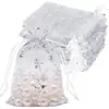 Bolsa de malla con copo de nieve repujado en oro transfronteriza, bolsa para empaquetar dulces navideños, bolsa de regalo para galletas y chocolates, bolsa transparente con cordón