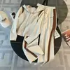 Conjunto deportivo informal de otoño para mujer, de fabricación europea, de nicho, ajustado, con capucha y cremallera, chaqueta y pantalones anchos, conjunto de dos piezas a la moda.