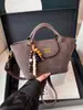 Bolso de Mano, Bolso Tote Pequeño, Bolso Retro de Color Café de Alta Gama para Viajar, Nuevo Bolso Cruzado de Hombro Único con Diseño de Nicho para Mujer