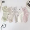 Calcetines para niñas Yishuangshuang, nuevos calcetines de otoño e invierno con forma de corazón de dibujos animados hasta la mitad de la pantorrilla, algodón peinado, calcetines estilo Miu con letras y caras sonrientes para estudiantes