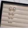 Pendientes de botón de perla S999 plateados por todas partes para mujer, sencillos y elegantes, pendientes de lujo ligero de alta gama, nuevo modelo popular 2026