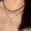 Colar Maillard de cordão de couro com estrela e sol de camada dupla, vintage, Spice Girl, personalidade, nicho, corrente de suéter superior