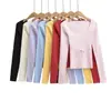 Top de punto ajustado de jacquard hueco de alta resistencia estilo americano para chica picante, cuello cuadrado, manga larga, color rosa, nuevo para Otoño e Invierno