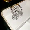 Pendientes de Metal Estilo Europeo y Americano Transfronterizos con Flor Hueca, Borla y Perla, Pendientes Vintage Elegantes con un Toque de Lujo Ligero y de Alta Gama