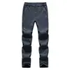Pantalones softshell suaves al por mayor para deportes al aire libre para hombre, corte ajustado, engrosados, nuevos pantalones softshell de forro polar para otoño e invierno, pantalones de senderismo para mujer
