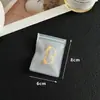 Un lote de pendientes pulsera bolsa de joyería esmerilada almacenamiento empaque cremallera portátil hebilla EVA a prueba de polvo acabado portátil