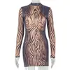 Nuevo vestido de mujer ajustado estilo europeo y americano con bloques de color y estampado negro, vestido ajustado estilo callejero, vestido corto sexy de manga larga y cuello redondo