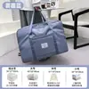 Bolsa de almacenamiento de viaje de gran capacidad, portátil para hombres y mujeres, bolsa de equipaje para gimnasio en rosa, morado, negro, diseño simple y elegante
