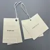 Etiqueta de Ropa de Papel Especial de PVC Personalización Etiqueta en Relieve Cóncava y Convexa Fábrica de Etiquetas de Ropa Personalizadas Personalización de Etiqueta Colgante