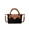 Bolsa de Dumpling Francesa Nueva de Verano Retro Bolso Cruzado Simple Ligero Bolso Pequeño Textura Suave Bolso para Teléfono Bolso Cuadrado Pequeño
