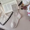 Estilo perezoso de principios de otoño~ Calcetines holgados para mujer, versión coreana, malla calada, calcetines de color liso hasta la mitad de la pantorrilla, calcetines blancos para mujer estilo japonés