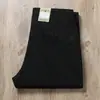 Pantalones largos casuales de negocios para hombre, de pierna recta, corte holgado, en color gris, hechos de algodón peinado, con tejido liso grueso y texturizado, y cintura media-alta, adecuados para otoño e invierno