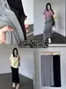 Falda de maternidad sin soporte para la barriga para mujer, estilo fino de primavera/verano, nuevo modelo 2026, talla grande, gris, fluida, falda de longitud media