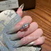 Anillo de hebilla de herradura de jade azul natural al por mayor del fabricante Xiaohongshu con incrustación de plata s925, diseño fresco y simple