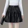 Falda corta abullonada para mujer, nuevo estilo otoño/invierno 2026, de cintura alta, adelgazante, falda acampanada plisada, anti-exposición, minifalda de capullo floral