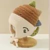 Bonitos y adorables gorros de otoño e invierno para niños, con diseño de poner, material de punto y una serie de dibujos animados, que brindan abrigo y protección para los oídos para bebés y niños pequeños.