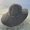 Sombrero de pescador a rayas blancas y negras transfronterizo nuevo para mujer, sombrero de sol plegable de verano, sombrero de ala ancha de moda, sombrero tipo cubo