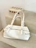 Bolso de hombro retro de nicho estilo coreano de gran capacidad para mujer, nuevo diseño simple 2026 con forma de caparazón