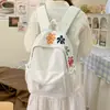 Mochila bordada floral de comercio exterior, mochila casual para estudiante, bolsa escolar simple de gran capacidad, versátil para ir al trabajo y viajar, para mujer