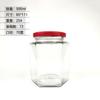 Venta al por mayor de fábrica botella hexagonal transparente de vidrio para miel multi-especificación botella vacía de miel y mermelada frasco hexagonal para alimentos Botella para pepinillos