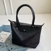 Nailon Gran Capacidad Moda Retro Versátil 2026 Bolso Nuevo Bolso de Viaje para Mujer Bolso de Hombro Único Bolso Tote para Mujer Bajo el Brazo