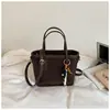Bolso pequeño con patrón tejido transfronterizo para mujer, diseño nuevo, elegante y moderno, bolso tipo cubo, alto valor estético, adecuado para ir al trabajo, bolso de hombro y cruzado