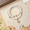 O Ponto Turístico Especializa-se em Oferecer 108 Pulseiras de Sementes de Bodhi de Jade Branco para Meditação e Prática Espiritual, Adequadas para Homens e Mulheres, Servindo tanto como Contas de Oração de Mão quanto como Pingentes de Pescoço