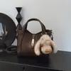 Bolsa de mão com padrão de lichia, design de nicho coreano, pequena bolsa tote, elegante e versátil, adequada para o trabalho, bolsa feminina, transfronteiriça