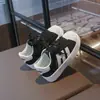 Tenis para niño, nueva colección primavera/otoño 2026, zapatos para niña, zapatos estilo concha para niños, tenis blancos casuales y transpirables para estudiantes de primaria