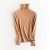 Suéter de capa base de lana auto-calentable con cuello alto apilado, suéter liso simple, nuevo top ajustado adelgazante de otoño e invierno
