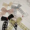 Tejido de malla seleccionado de alta calidad con lazos decorativos hechos a mano DIY de doble cara, ribete de encaje y tela bordada colorida para los bajos de la falda.