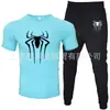 2025 Novo Conjunto Casual Esportivo Masculino de Duas Peças: Camiseta de Manga Curta e Calça, Verão, Gola Redonda, Cor Lisa, Estampado