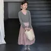 Conjunto de Primavera y Otoño para Niñas 2026 Nuevo Dulce Estilo Coreano Top Falso de Dos Piezas y Conjunto de Falda Floral Tendencia Transfronteriza