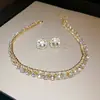 Conjunto de collar con colgante de gota de diamante transfronterizo para mujer, cadena para clavícula de moda nicho de lujo ligero, joyería versátil, sentido de alta gama para mujer