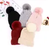 Otoño e invierno 2021 lindo gorro de lana tejido para mujer cálida protección para las orejas gorro con pompón de pelo para exteriores frío gorro para adultos al por mayor
