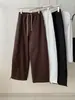 Pantalones jogger de cordón estilo minimalista coreano para mujer, versátiles y adelgazantes, con un tacto relajado, pantalones de pierna ancha con retazos, Otoño 2026