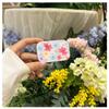Estilo Ins Espejo Plegable con Flor Clip Trasero para Teléfono Móvil Espejo de Maquillaje Creativo Correa Cruzada Soporte Universal Anti-pérdida Portátil