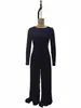 Sitio web independiente de comercio exterior europeo y americano Nueva colección otoño/invierno 2026: mono casual de un solo color, cuello alto, manga larga y pierna ancha para mujer