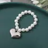 Muñeca Perro Líder Linda Colgante Collar Corazón de Melocotón Muñeca de Peluche con Cuentas Hecha a Mano DIY Decoración de Múltiples Tamaños Venta al por Mayor